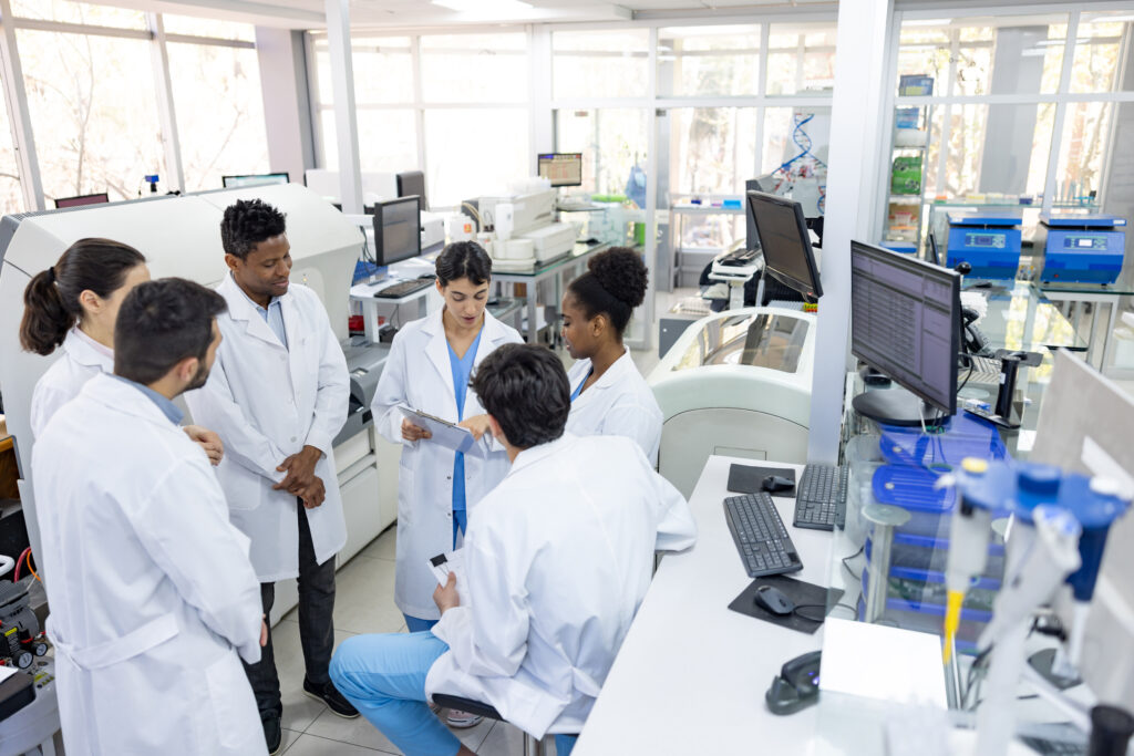 Team of scientists talking in a staff meeting at the laboratory